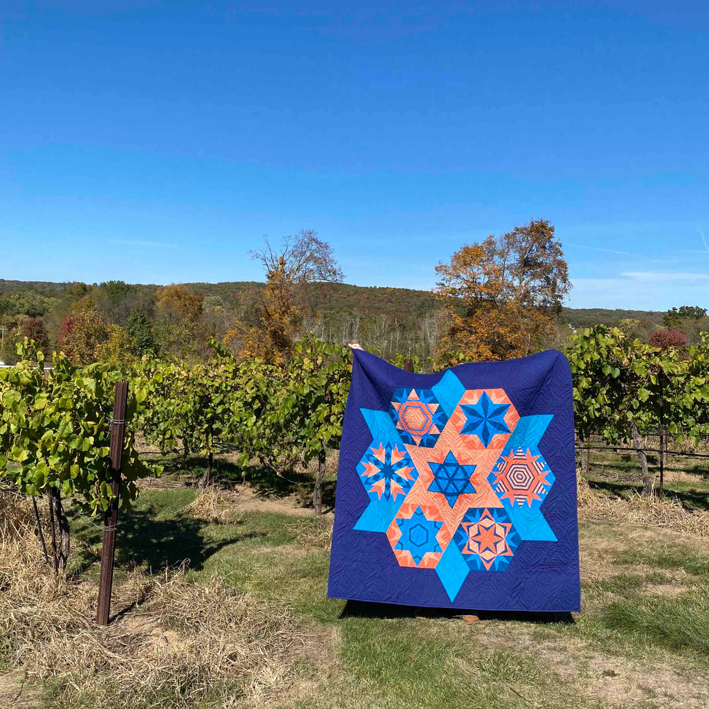 Quilt with geometric pattern in a vineyard setting